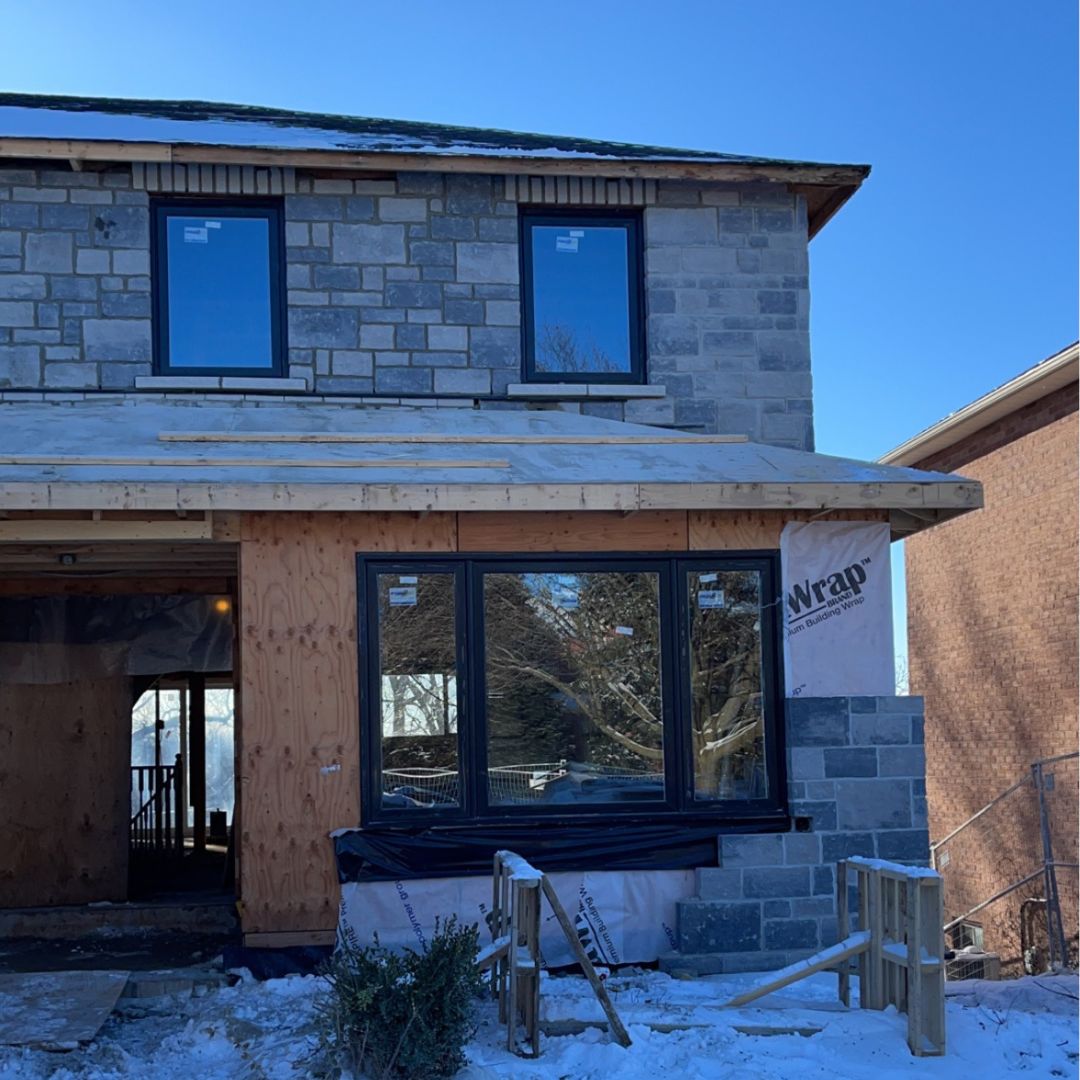 Stone masonry exterior on a home under construction